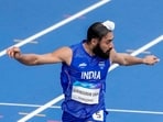 Gurindervir Singh competes in the men's 100m round 1 heat.