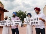 Punjab Congress MPs Amarinder Singh Raja Warring, Dr Amar Singh, Gurjeet Singh Aujla and Sher Singh Ghubaya protesting outside the Parliament in New Delhi on Monday.