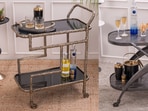 A thoughtfully styled bar cart adds function, charm and visual interest, turning an unused corner into a conversation-worthy focal point. 