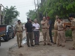 Railway and police officials inspect the road outside the Chandigarh railway station on Monday. (Sant Arora/HT)