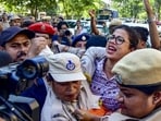 Security personnel detain demonstrators during the NEET protests in Guwahati on July 25. (PTI)