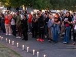 SEATTLE, WASHINGTON - JULY 27: People gather for a vigil a day after the Bite of Seattle food festival shooting at Seattle Center on July 27, 2026 in Seattle, Washington. (Photo by David Ryder / GETTY IMAGES NORTH AMERICA / Getty Images via AFP)(Getty Images via AFP)