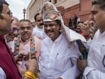 Former education minister Dharmendra Pradhan being greeted during the Monsoon session of Parliament on Monday