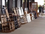 Rocking chairs are displayed for sale at a Cracker Barrel. The chain just hired a former restaurant executive as its next CEO.