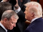 US President Donald Trump, next to Supreme Court Chief Justice John Roberts, arrives to deliver the State of the Union address to a joint session of Congress in the House Chamber at the Capitol on February 2.