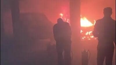 A purported video of the incident also went viral on social media on Tuesday, showing a security guard trying to douse the flames with fire extinguishers amid thick smoke billowing through the basement. (HT Photos)