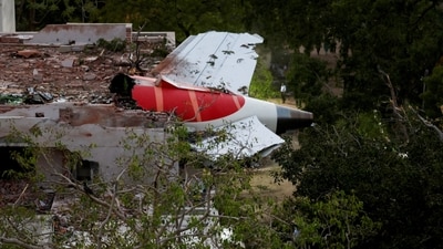 Tail of Air India Boeing 787 Dreamliner plane that crashed is seen stuck on a building after the incident in Ahmedabad. (REUTERS)