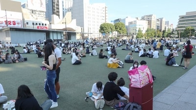 Japan Earthquake: People wait in a park after evacuating buildings after a strong earthquake hit Kumamoto City's Chuo Ward on July 28, 2026. Prime Minister Takaichi Sanae said a major earthquake hit southwestern Japan, causing buildings to collapse and fires to occur. Broadcaster NHK said at least 50 people were taken to hospital. (Photo by Jiji/AFP)/Japan OUT (AFP)