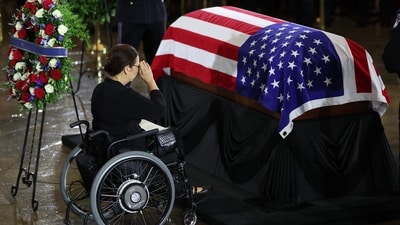 Sen. Tammy Duckworth, D-Ill., pays her respects during a congressional tribute to the late Sen. Lindsey Graham, R-S.C., in the Rotunda of the U.S. Capitol, Tuesday, July 28, 2026, in Washington. (Win McNamee/Pool via AP) (Win McNamee/Pool Getty Images No) Sen. Tammy Duckworth, D-Ill., pays her respects during a congressional tribute to the late Sen. Lindsey Graham, R-S.C., in the Rotunda of the U.S. Capitol, Tuesday, July 28, 2026, in Washington. (Win McNamee/Pool via AP) (Win McNamee/Pool Getty Images No)