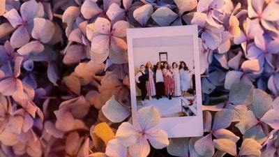 The Polaroid photo shows victim Ashley Whitehead (3L) during a vigil a day after the Bite of Seattle food festival shooting at Seattle Center. &nbsp; (David Ryder/Getty Images/AFP)