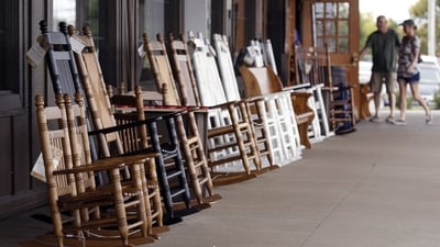 Rocking chairs are displayed for sale at a Cracker Barrel. The chain just hired a former restaurant executive as its next CEO.