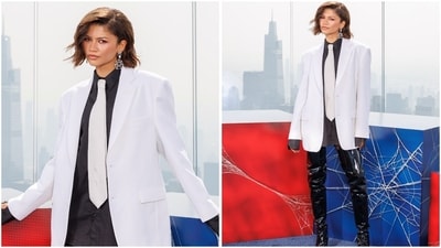 Landing in New York City, Zendaya appeared to pay homage to Spider-Man villain Mister Negative in a sharp white blazer from Vetements' Spring 2027 ready-to-wear collection. She paired it with an oversized black shirt, a matching white tie and statement thigh-high vinyl boots. (Instagram) Landing in New York City, Zendaya appeared to pay homage to Spider-Man villain Mister Negative in a sharp white blazer from Vetements' Spring 2027 ready-to-wear collection. She paired it with an oversized black shirt, a matching white tie and statement thigh-high vinyl boots. (Instagram)