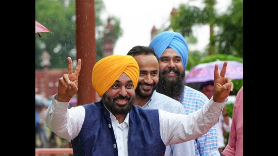 Chief minister Bhagwant Mann with AAP MPs Gurmeet Singh Meet Hayer and Malvinder Kang outside the Parliament in New Delhi on Tuesday. (PTI)