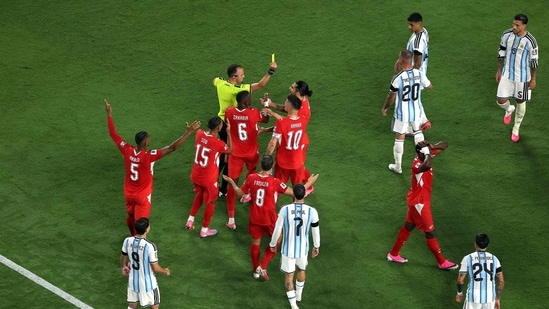 Referee Joao Pinheiro shows a second yellow card to Breel Embolo during the FIFA World Cup 2026 Quarter Final match between Argentina and Switzerland