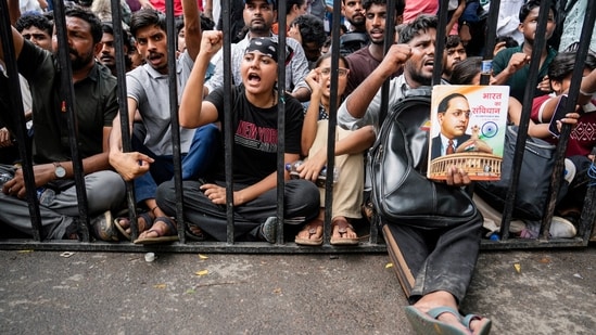 Cockroach Janata Party supporters raise slogans at Jantar Mantar in New Delhi.
