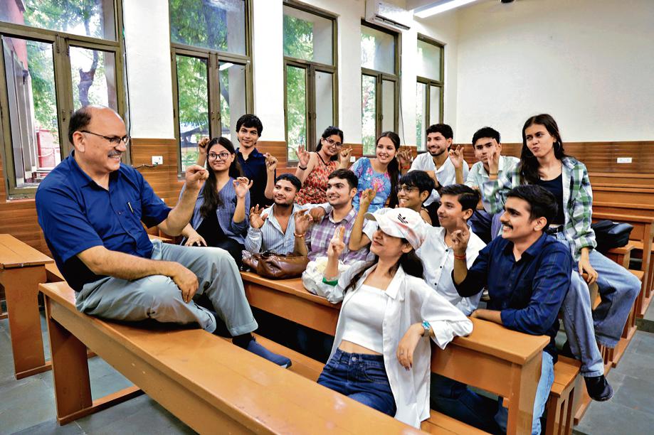 Prof Dinesh Khattar, principal of Kirori Mal College knows how to 'clock it' when it comes to welcoming freshers on campus. Prof Dinesh Khattar, principal of Kirori Mal College knows how to 'clock it' when it comes to welcoming freshers on campus.