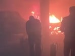 A purported video of the incident also went viral on social media on Tuesday, showing a security guard trying to douse the flames with fire extinguishers amid thick smoke billowing through the basement. (HT Photos)