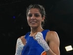 India's Sakshi Sakshi celebrates after winning her bout with Northern Ireland's Caitlin Fryers in the women's 51kg quarterfinal at the Commonwealth Games in Glasgow