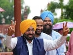 Chief minister Bhagwant Mann with AAP MPs Gurmeet Singh Meet Hayer and Malvinder Kang outside the Parliament in New Delhi on Tuesday. (PTI)