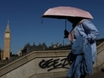 A person uses an umbrella to shield from the sun as they walk near the Elizabeth Tower -more commonly known as Big Ben - and the Houses of Parliament, whilst near drought conditions continue in many parts of the UK, in London, Britain, July 29, 2026. (REUTERS)