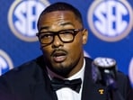 Arion Carter, star linebacker for Tennessee, faces a two-game NCAA suspension for an agent-funded flight to pre-draft training. 