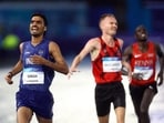 Gulveer Singh crosses the finish line after the Men's 10,000m Final.