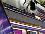 The Federal Reserve maintained interest rates at 3.5%-3.75% despite a 9-3 vote reflecting concerns over inflation.