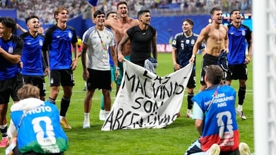 Argentina's Giovani Lo Celso, right, holds a banner with the words "The Malvinas are Argentine", referring to the Falkland Islands, at the end of the World Cup semifinal (AP Photo/Rebecca Blackwell) Argentina's Giovani Lo Celso, right, holds a banner with the words "The Malvinas are Argentine", referring to the Falkland Islands, at the end of the World Cup semifinal (AP Photo/Rebecca Blackwell)
