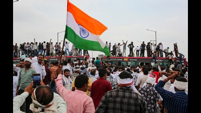 Farmers stand atop a bus as they stage a protest to press for various demands in Bhopal in Madhya Pradesh on Wednesday. (PTI) Farmers stand atop a bus as they stage a protest to press for various demands in Bhopal in Madhya Pradesh on Wednesday. (PTI)