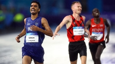 Gulveer Singh crosses the finish line after the Men's 10,000m Final. (REUTERS)