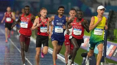 Gulveer Singh of India (blue) competes in the men's 10,000 meters final at the Commonwealth Games in Glasgow, Scotland, Tuesday. (AP Photo/Eranga Jayawardena) Gulveer Singh of India (blue) competes in the men's 10,000 meters final at the Commonwealth Games in Glasgow, Scotland, Tuesday. (AP Photo/Eranga Jayawardena)
