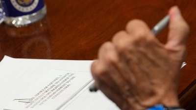 A note lies on a table in front of Anthony Fauci, the former Director of the National Institute of Allergy and Infectious Diseases (NIAID) and medical advisor to several US presidents. (REUTERS)
