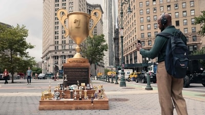 People take pictures of the 'Iran War Participation Trophy' at Foley Square on July 29, 2026 in New York City. People take pictures of the 'Iran War Participation Trophy' at Foley Square on July 29, 2026 in New York City.