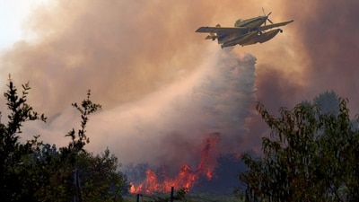 A firefighting plane dumping water on flames west of Madrid this past weekend. A firefighting plane dumping water on flames west of Madrid this past weekend.