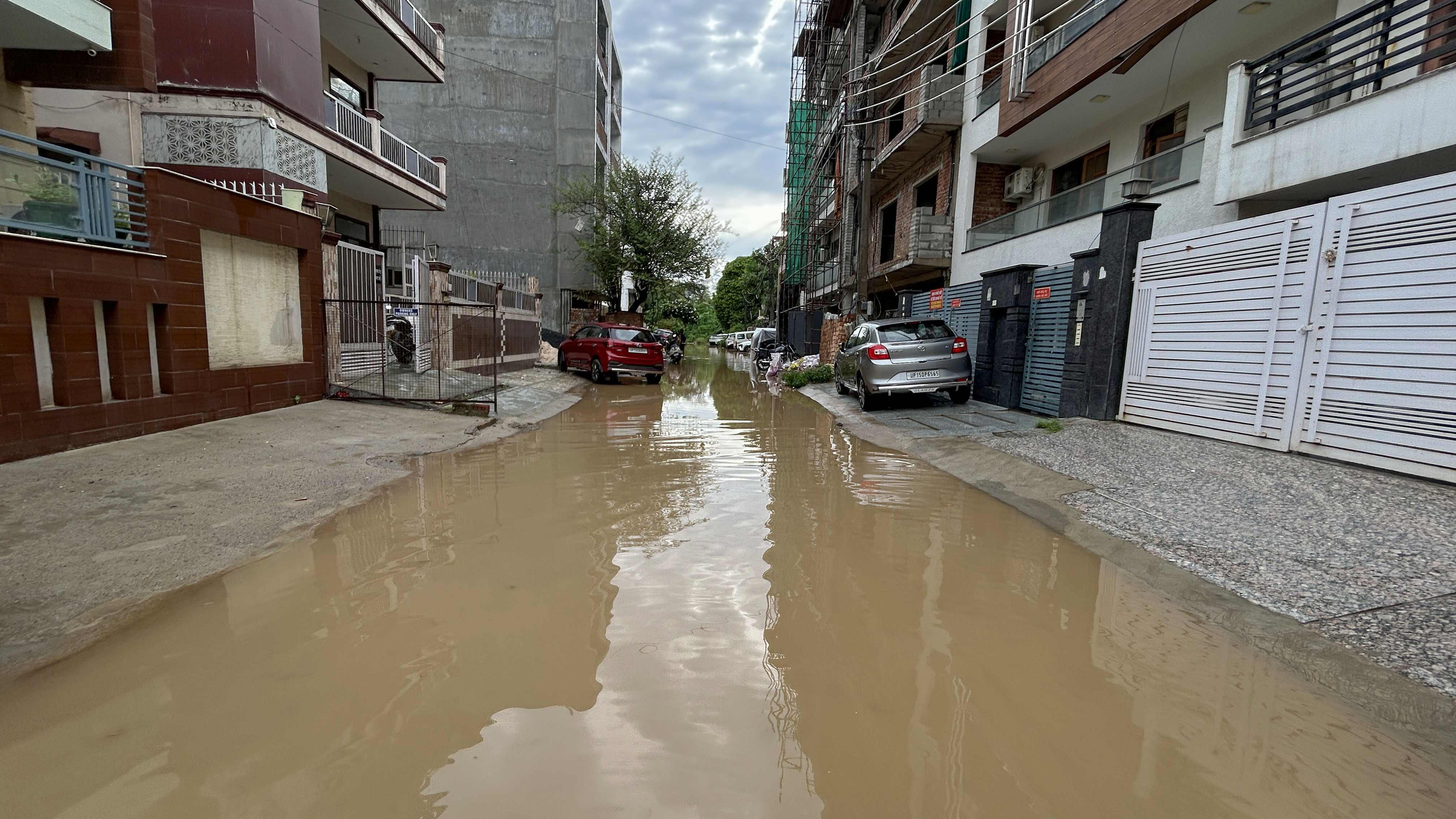 A flooded internal road in Sector 43 near Galaxy Apartments on Tuesday. (Parveen Kumar/HT)