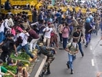 Security personnel carry out a lathi charge during the CJP protest march near the Parliament in New Delhi, India, on Monday, July 20, 2026.  