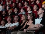Spectators view the 70 mm Imax copy of Christopher Nolan's 