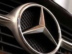 Mercedes recalls 310,667 US vehicles over a door lock issue as weak China sales, falling demand and intense competition force the carmaker to cut its forecast. (REUTERS/Dado Ruvic/Illustration/File Photo)