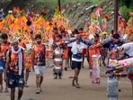 'Kanwariyas' proceed to collect holy water of the Ganga river during the annual 'Kanwar Yatra', in Haridwar, Uttarakhand.