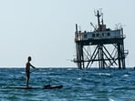 A man rides a stand-up paddleboard in the Black sea in Simeiz, on the Russian-annexed peninsula of Crimea. (Photo by Igor IVANKO / AFP)