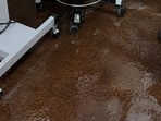Videos showed patients and attendants wading through ankle-deep water, with buckets placed across the building to collect rainwater from leaking roofs. (Sourced)