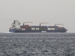 A commercial vessel passes through an international shipping lane off Yemen's Hanish Island in the Red Sea on July 27, 2026.