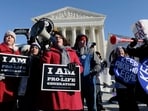 FILE - Pro-abortion and anti-abortion protestors rally outside the Supreme Court in Washington, Wednesday, Jan. 22, 2014, during the March for Life.