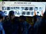 A banner shows photographs of students who allegedly took their lives following the NEET-UG 2026 paper leak, during a protest at Jantar Mantar in New Delhi.