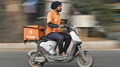 A food delivery worker for Swiggy, in Bengaluru (AFP) A food delivery worker for Swiggy, in Bengaluru (AFP)