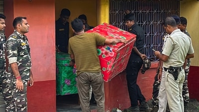 Police seize cash worth several crores of rupees and kilograms of gold during a raid at the residence of former government bus driver-turned-stone trader Minar Mondal. (PTI) Police seize cash worth several crores of rupees and kilograms of gold during a raid at the residence of former government bus driver-turned-stone trader Minar Mondal. (PTI)