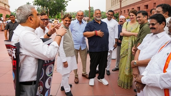 TMC MP Kalyan Banerjee stage a protest as Congress MPs Priyanka Gandhi Vadra, Imran Masood, MP Pappu Yadav and others look on during the Monsoon session of Parliament, in New Delhi.