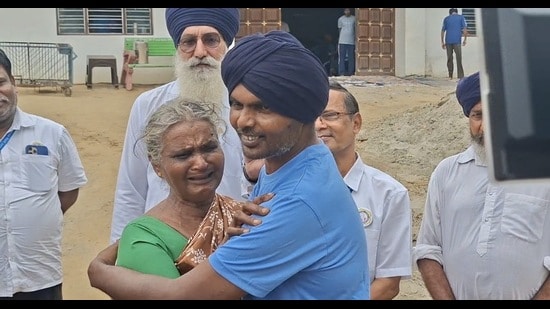 Prakasam with his mother after being reunited in Patiala. (HT)