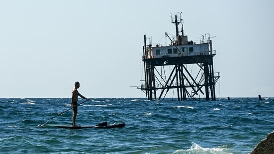 A man rides a stand-up paddleboard in the Black sea in Simeiz, on the Russian-annexed peninsula of Crimea. (Photo by Igor IVANKO / AFP)