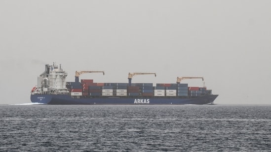 A commercial vessel passes through an international shipping lane off Yemen's Hanish Island in the Red Sea on July 27, 2026.